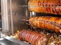 Load image into Gallery viewer, Rotisserie Whole Porchetta. Flame Show Cooking Catering or Drop Off Catering

