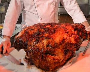 Rotisserie Whole Steamship of Beef. Flame Show Cooking Catering or Drop Off Catering